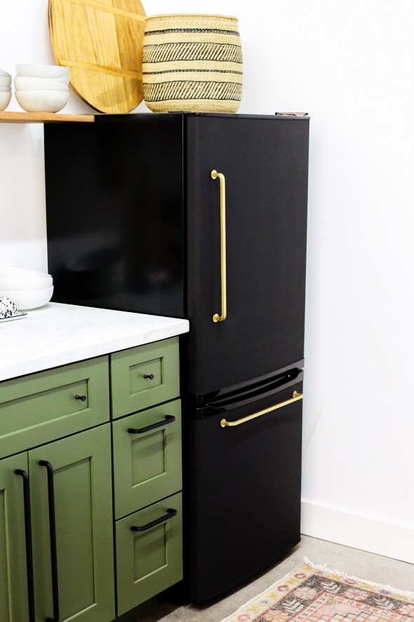 black fridge with copper handles