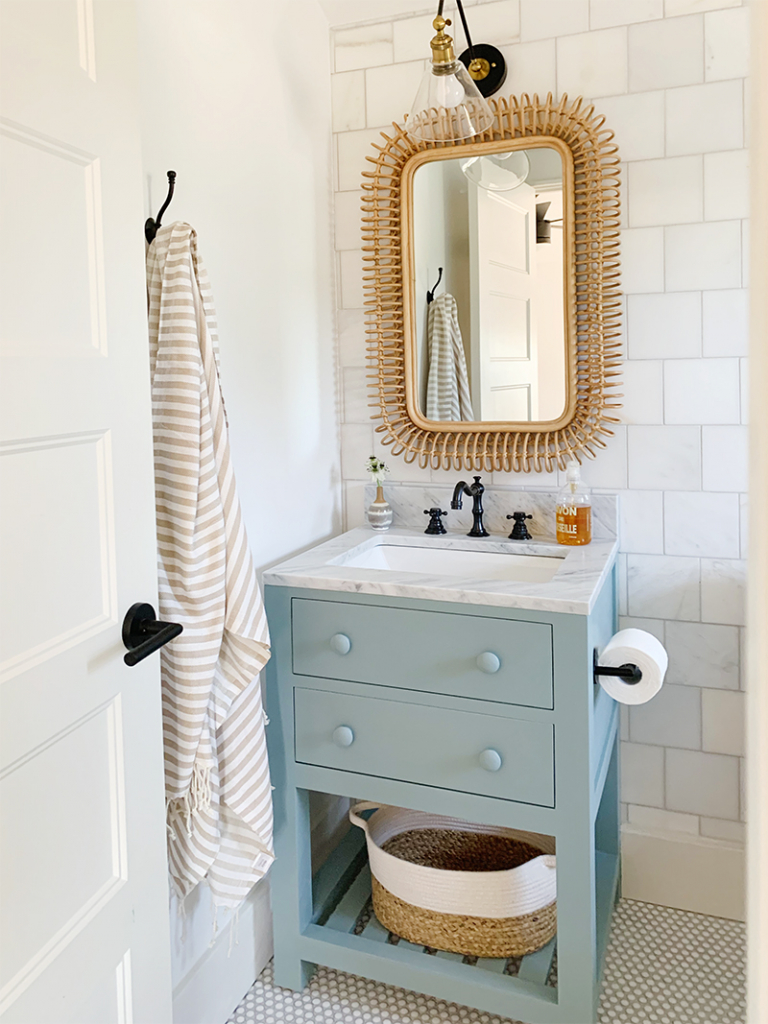 single sconce over bathroom mirror